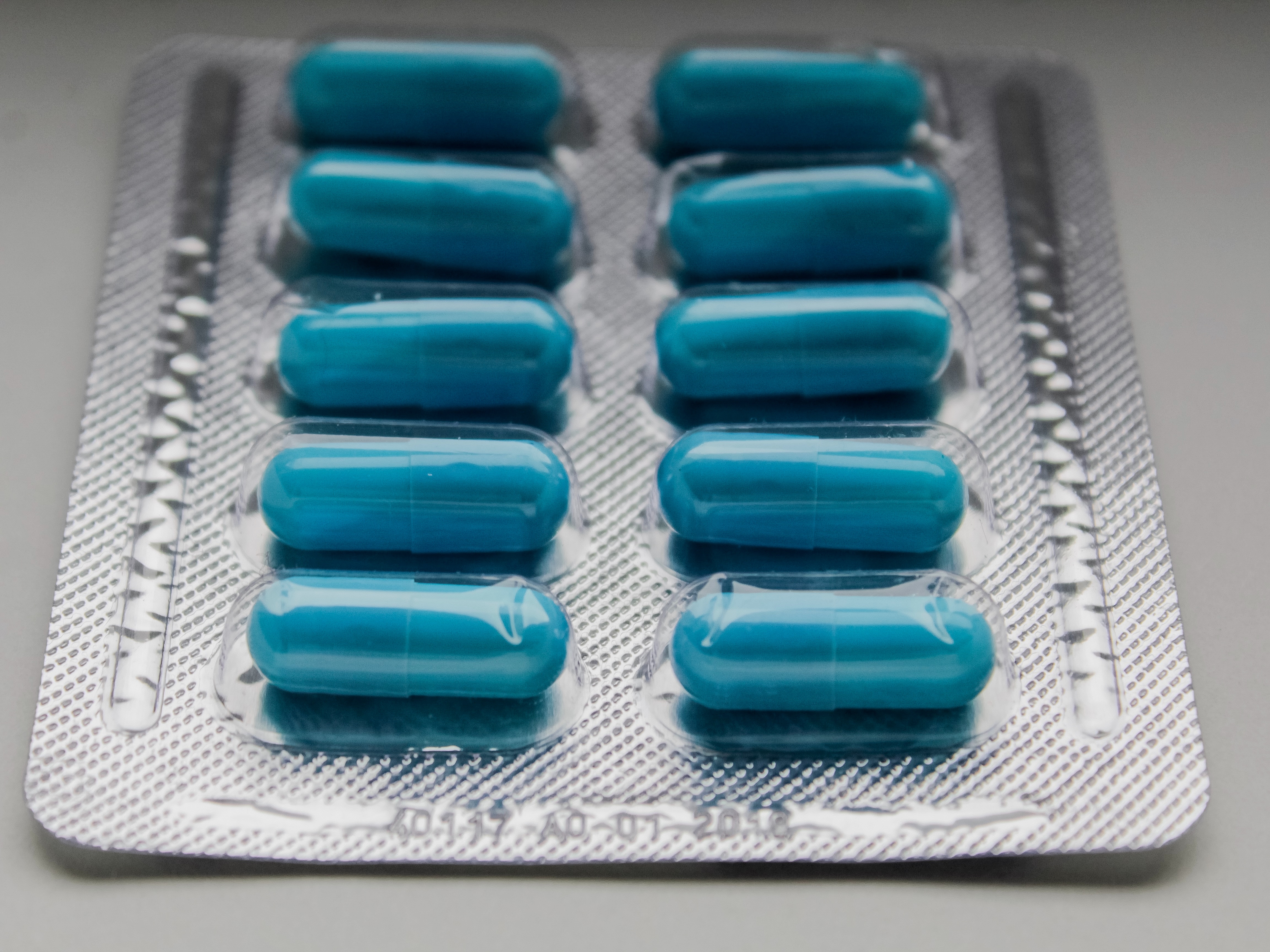 Blue pills in packaging.